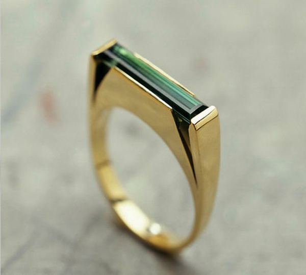emerald and gold engagement ring