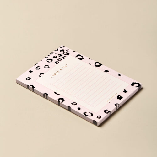 small to do list notepad with pink leopard print patterned border. Image taken at an angle to show how thick the 50 tearaway pages are.