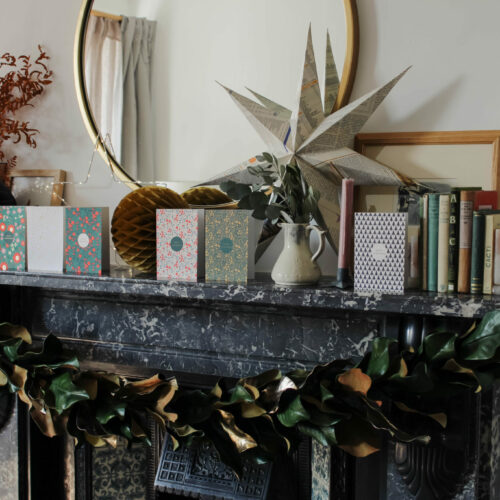 perfect christmas fireplace decor with christmas cards and wreath