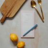 pink check shopping list notepad