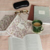 reading in bed with tea and your book journal - pink block print journal and sound waves and rust journals