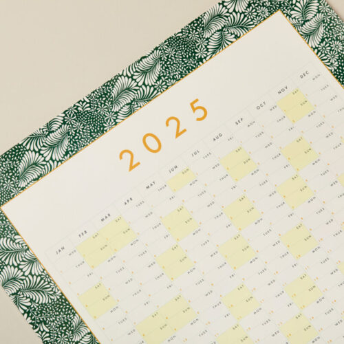 a close up image of a green bordered 2025 year planner