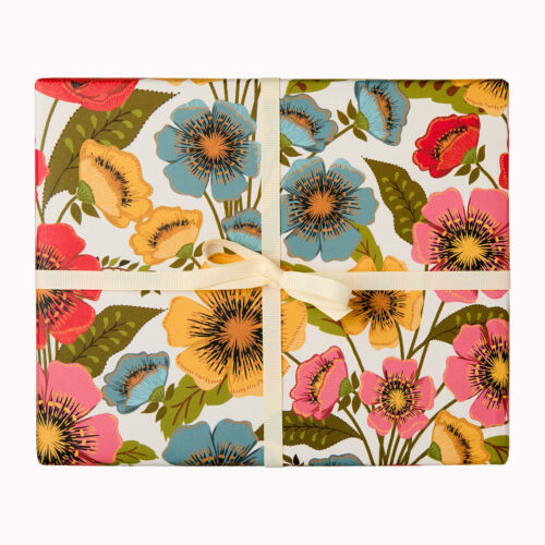 Luxury floral wrapping paper perfect for garden lovers. The design is a bold floral made up of poppy like flowers in red, pink, blue and yellow